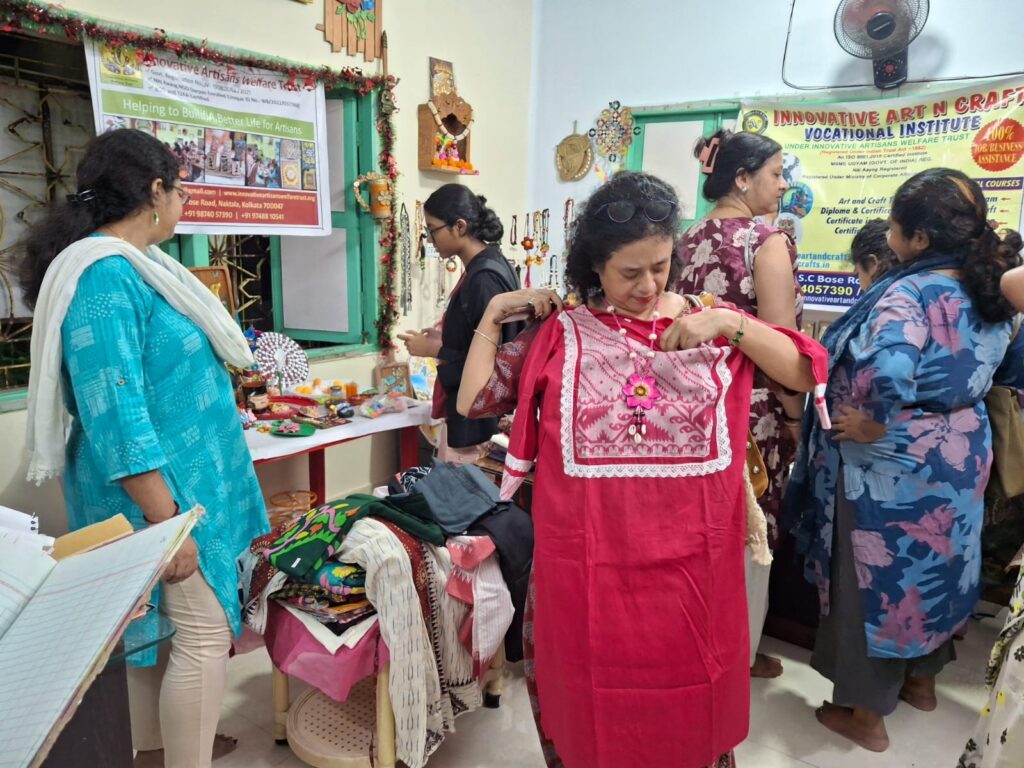 Visitor shopping sustainable handcrafted jewellery and decor at Pre-Puja Splendor 2025.