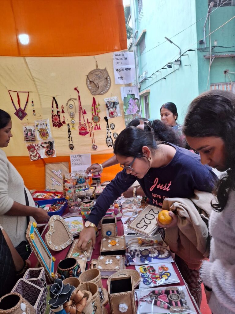 Women entrepreneurs selling handicrafts after completing art and craft diploma courses