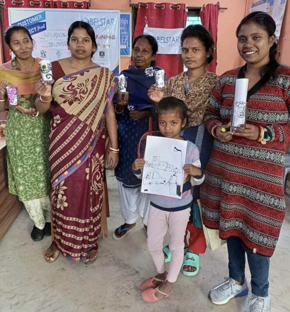 Artisans celebrating their success and showcasing crafts at a community event organized by the trust.