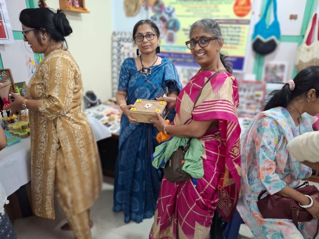 Women entrepreneurs selling handmade crafts through icrafts.in to earn financial independence.