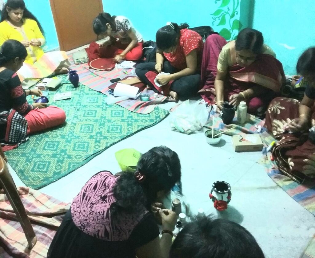 Women receiving professional art and craft training to gain skills and employment opportunities.